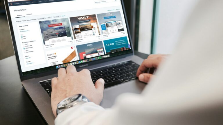 Person working in a CRM and quoting workflow on a laptop