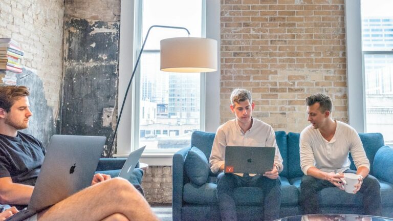 Benefits administration team working together in a modern office