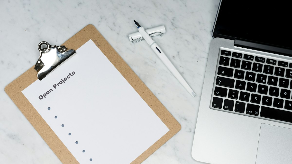 Compliance checklist and laptop used for a credentialing standards review